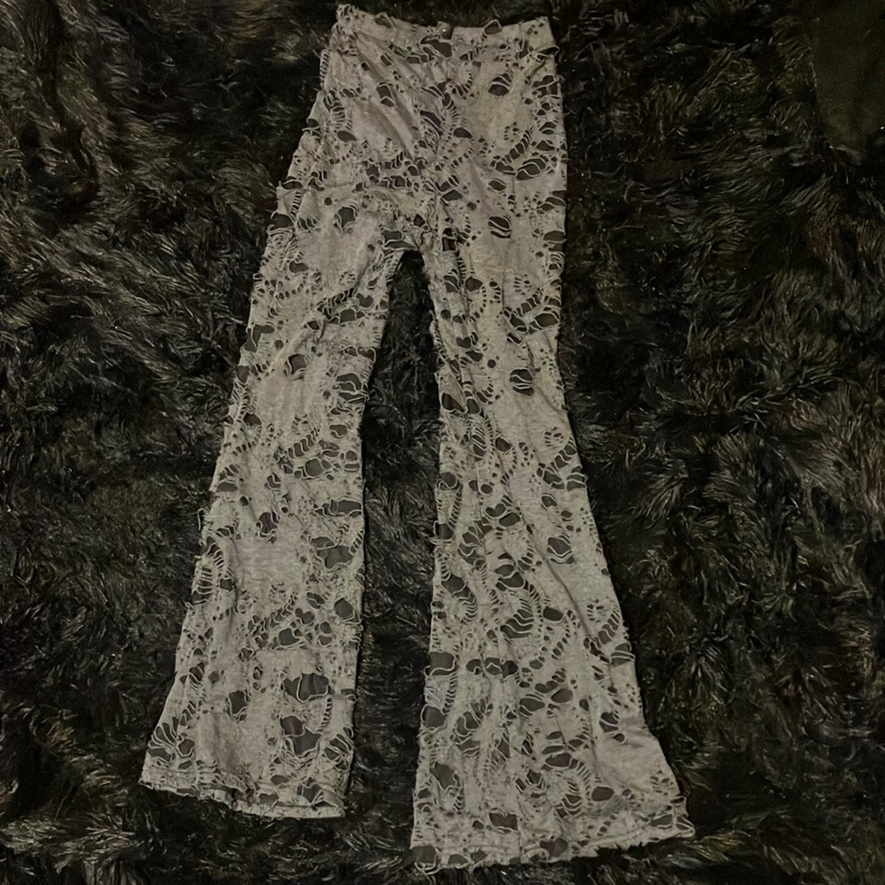 grey flare sweats with holes that have cotton material